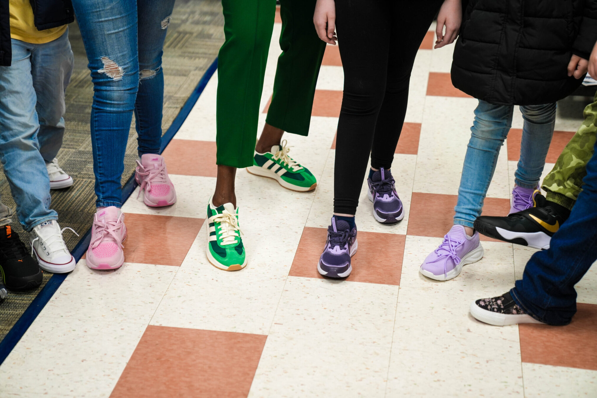 Students at Oakwood-Windsor Elementary School try out their new shoes, donated by SRP Federal Credit Union.