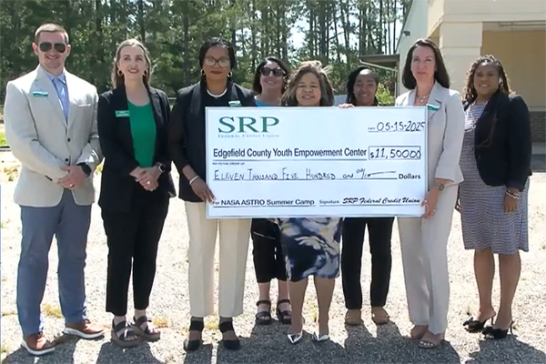 ECYECCheckPresentation Representatives of SRP Federal Credit Union present the Edgefield County Youth Empowerment Center with a check funding the organization's summer STEAM program.