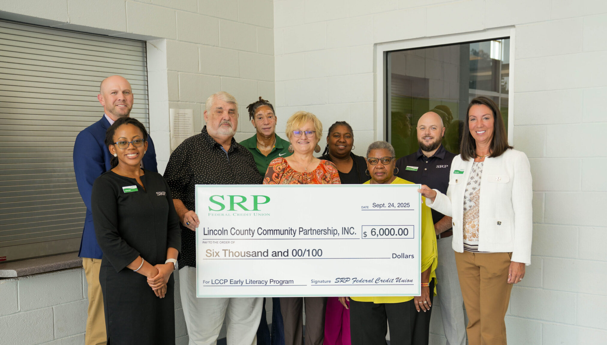 Representatives of SRP Federal Credit Union and the Lincoln County Community Partnership, Inc. celebrate SRP's donation of $6,000 with a ceremonial check.