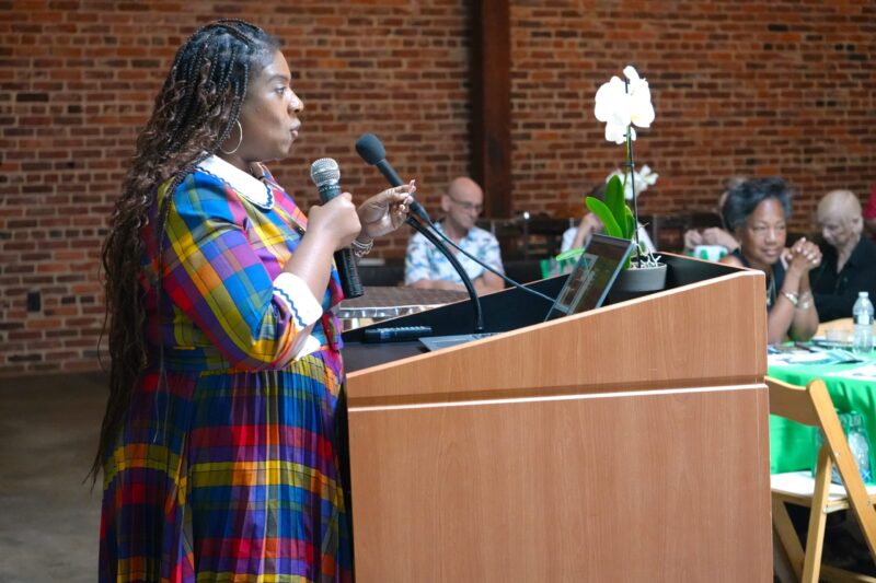 SRP Financial Services Engagement Developer Tawanaca Williams reads a door prize ticket after a 