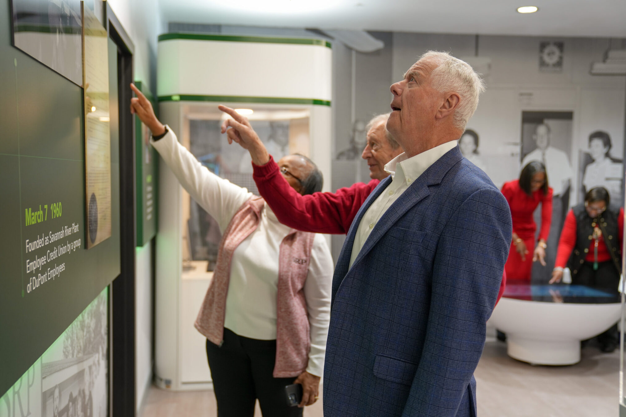 Members of the SRP Board of Directors view the historical timeline of SRP Federal Credit Union at the SRP Museum.
