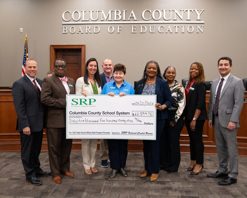Columbia County Affinity Check Presentation 2026 5x7 SRP Federal Credit Union representatives join the Columbia County Board of Education for a check presentation ceremony.