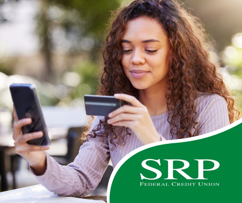 A college student holds a credit card.