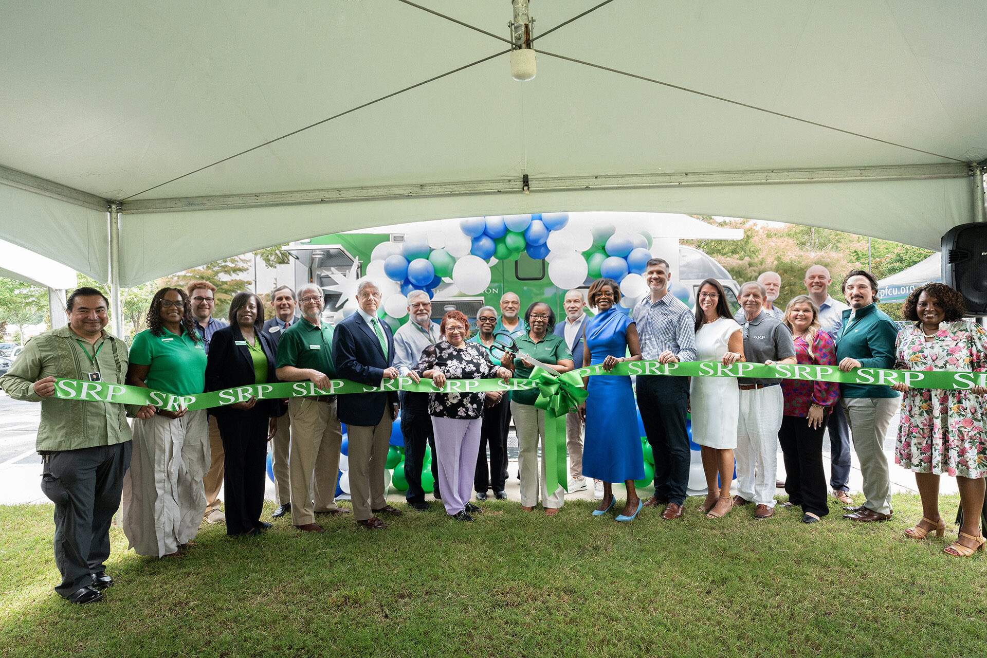 Local leaders join SRP Federal Credit Union board members and executives in a ribbon-cutting ceremony for the SRP Mobile Branch.
