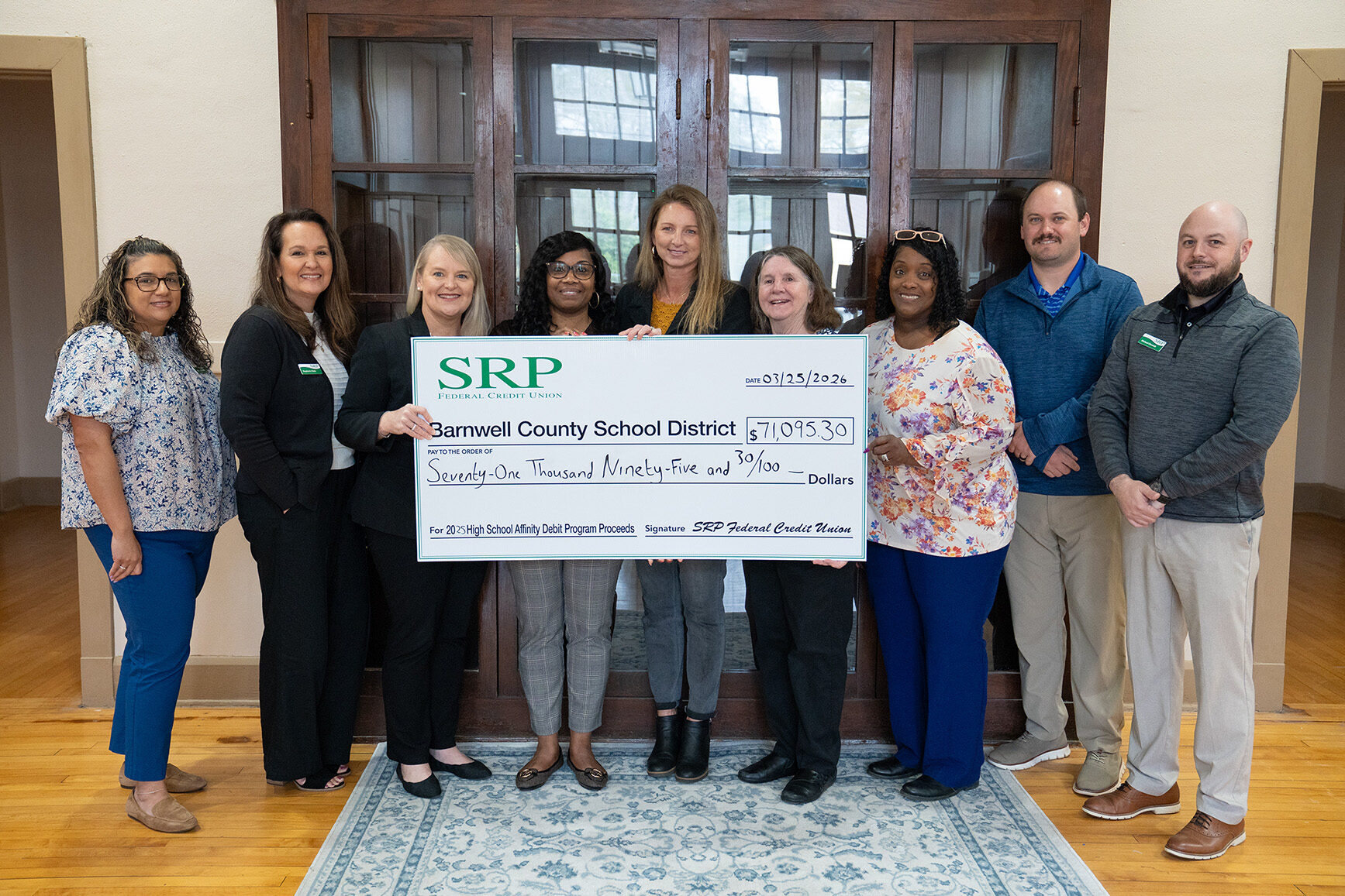 Barnwell Check Presentation SRP Federal Credit Union representatives join Barnwell County School District board members and Superintendent Dr. Stapleton behind a ceremonial check for $71,095.30.