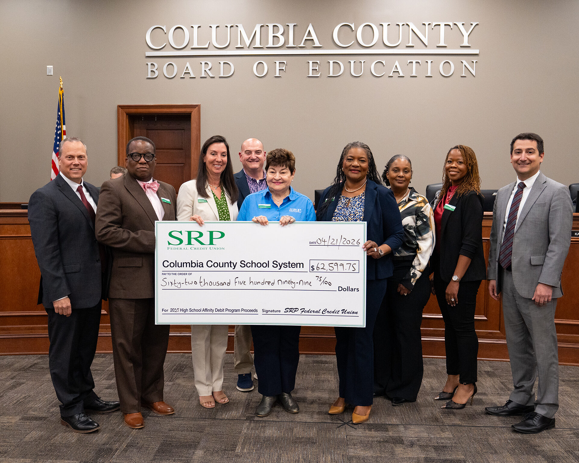 Columbia County Affinity Check Presentation 2026 5x7 SRP Federal Credit Union representatives join the Columbia County Board of Education for a check presentation ceremony.