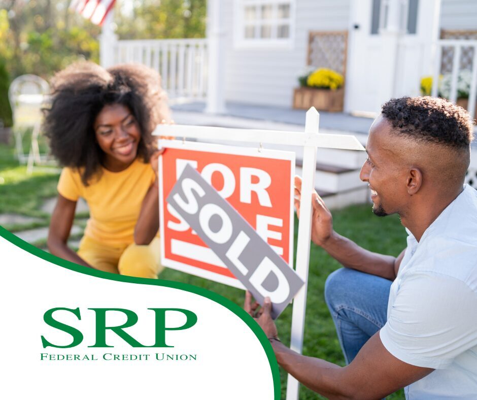 May - A seller's market vs. a buyer's market A couple poses next to a