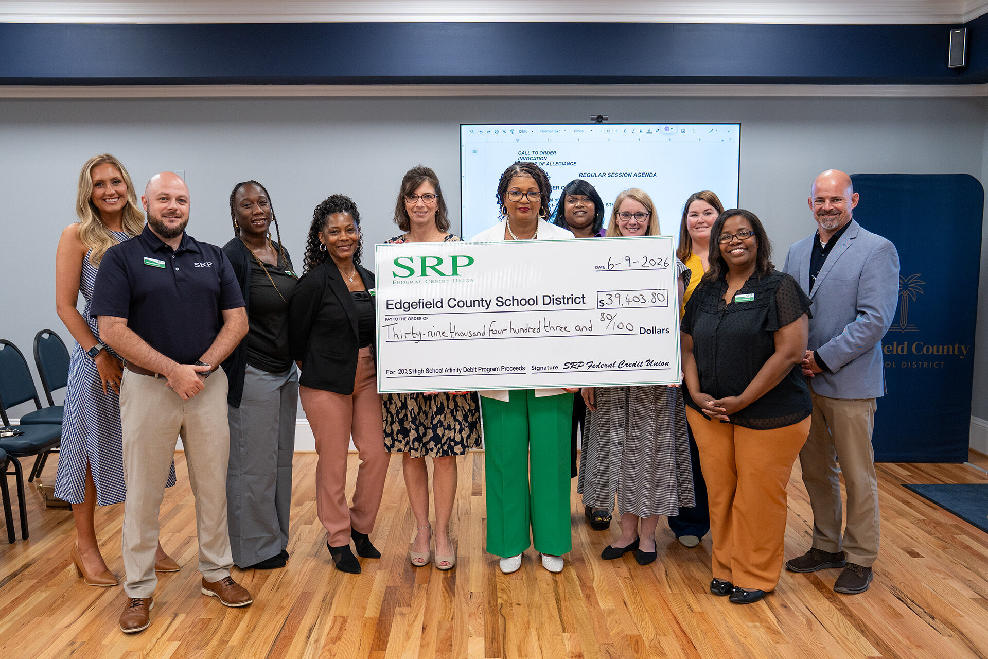 Strom Thurmond High Check SRP representatives join the Edgefield County Board of Education and Strom Thurmond High School principal in a check presentation ceremony.