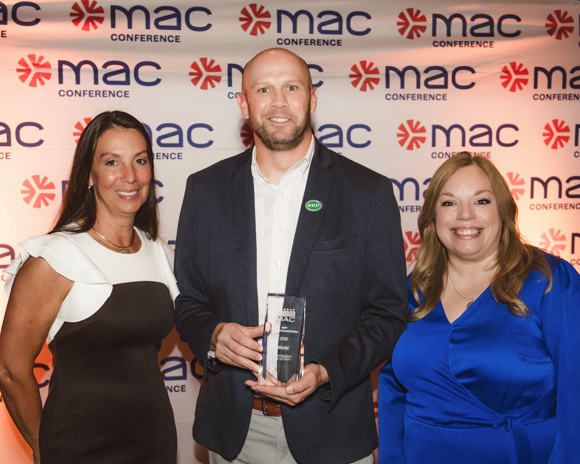 MAC Award 2026 SRP Chief Development Officer Shana Reid, Marketing and Communications Manager Josh Rhoden, and AVP of Marketing and Communications Allyson Teevan hold the Gold MAC Award in Public Relations.