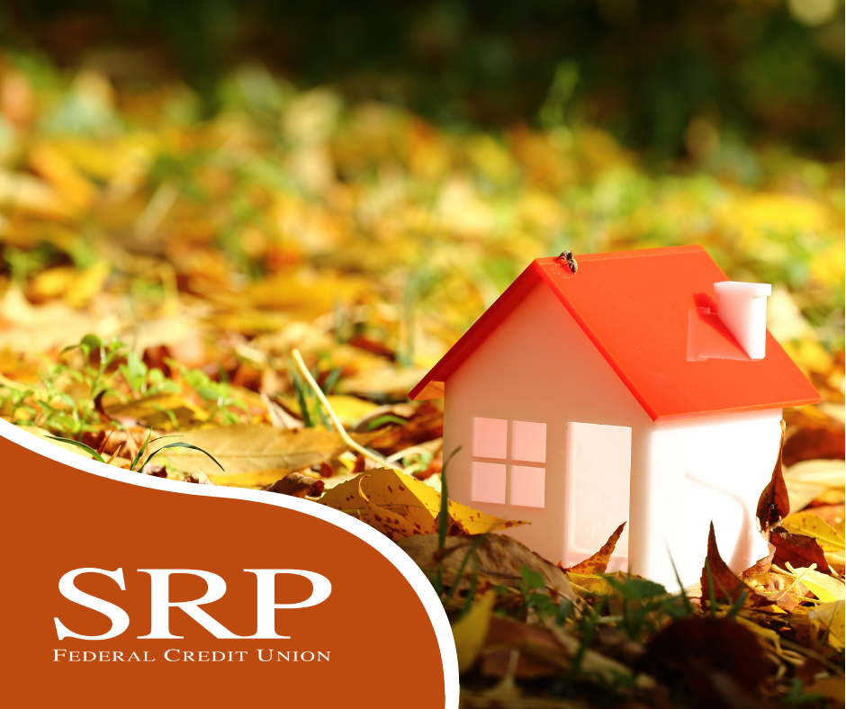 Understanding Insurance and Benefits A house figurine surrounded by autumn leaves.